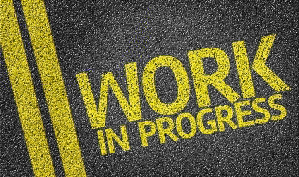 Work In Progress written on the road
